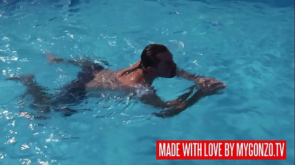 Blonde babe Rebeca Cerrera with big fake tits gets a hardcore fuck from Leslie Taylor outdoor near the swimming pool