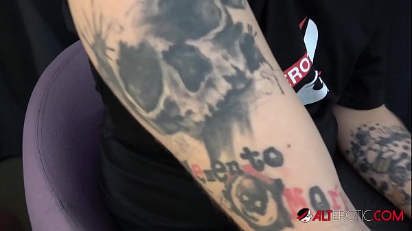 Sexy brunette with big tits sucks and fucks while giving a tattoo